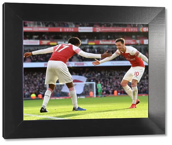 Arsenal's Iwobi and Ozil: United in Triumph - Celebrating a Goal Against Burnley, 2018-19 Premier League