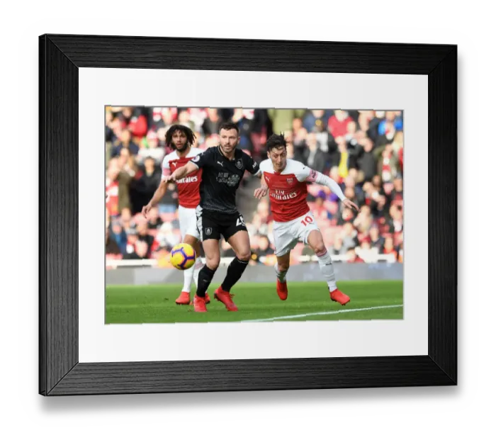 Framed Print : Mesut Ozil vs. Phil Bardsley: Battle for Ball Possession - Arsenal vs. Burnley, Premier League 2018-19