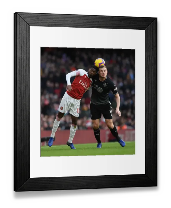 Framed Print : Arsenal vs Burnley: Ainsley Maitland-Niles vs Chris Wood Battle at Emirates Stadium