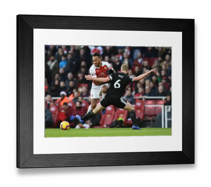 Framed Print : Clash at Emirates: Aubameyang vs Mee in Arsenal's Battle Against Burnley