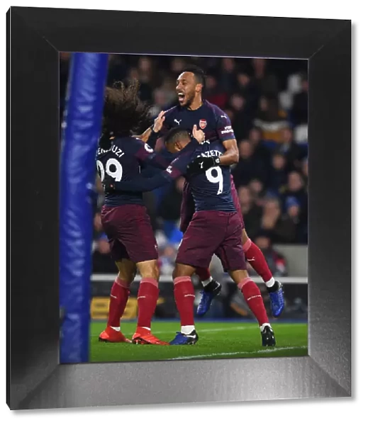 Arsenal's Aubameyang, Lacazette, and Guendouzi Celebrate Goal Against Brighton (2018-19)
