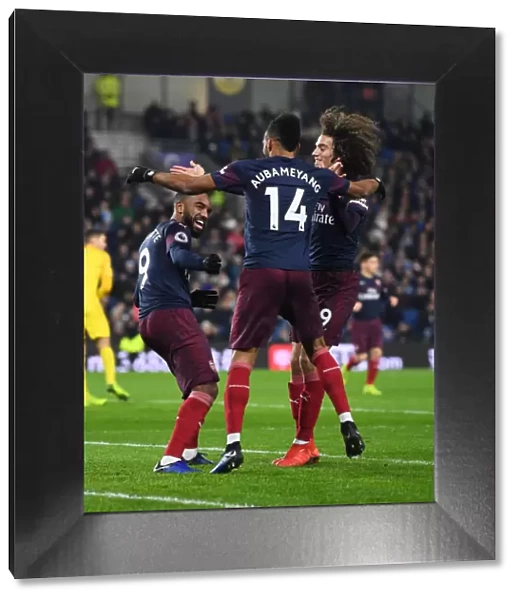 Arsenal's Triumph: Aubameyang, Lacazette, and Guebdouzi Celebrate Goal Against Brighton (December 2018)