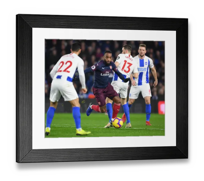 Framed Print : Alexis Lacazette Outsmarts Pascal Gross: Arsenal's Triumph Over Brighton