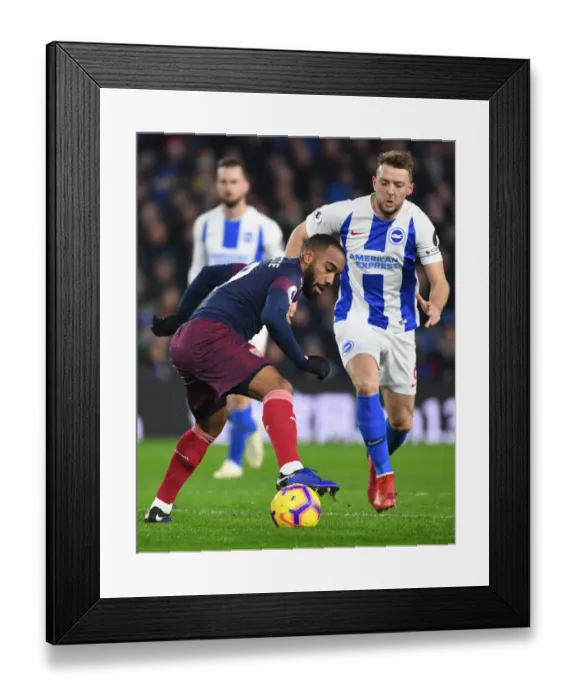 Framed Print : Arsenal's Lacazette Clashes with Brighton's Stephens in Premier League Showdown Framed Print : Arsenal's Lacazette Clashes with Brighton's Stephens in Premier League Showdown