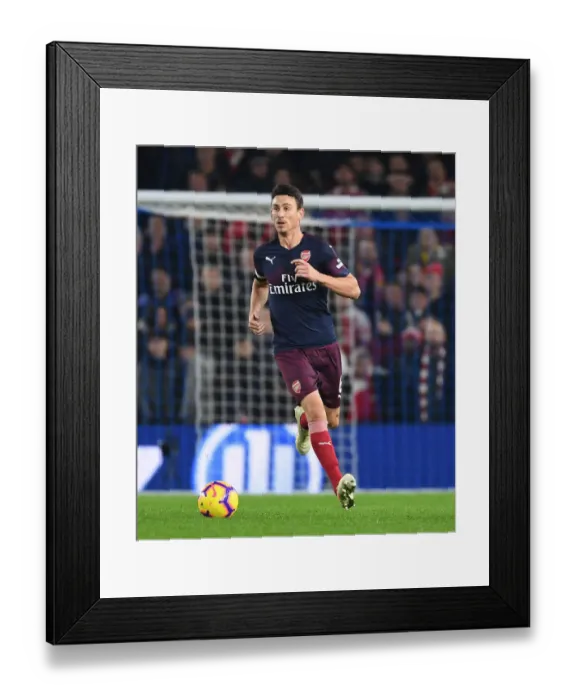 Framed Print : Arsenal's Koscielny Focuses in Intense Premier League Clash Against Brighton Framed Print : Arsenal's Koscielny Focuses in Intense Premier League Clash Against Brighton