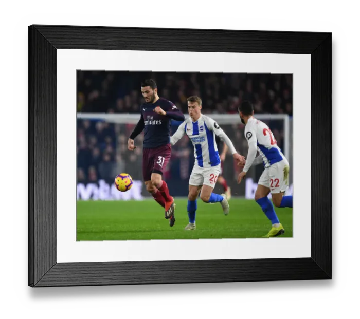 Framed Print : Arsenal's Sead Kolasinac Outmaneuvers Brighton's Defense in Premier League Clash