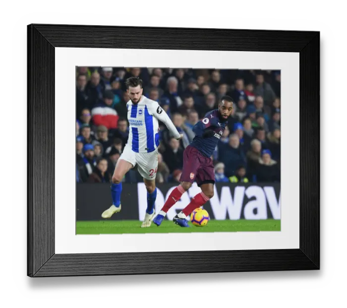 Framed Print : Arsenal's Lacazette Faces Off Against Brighton's Propper in Premier League Clash
