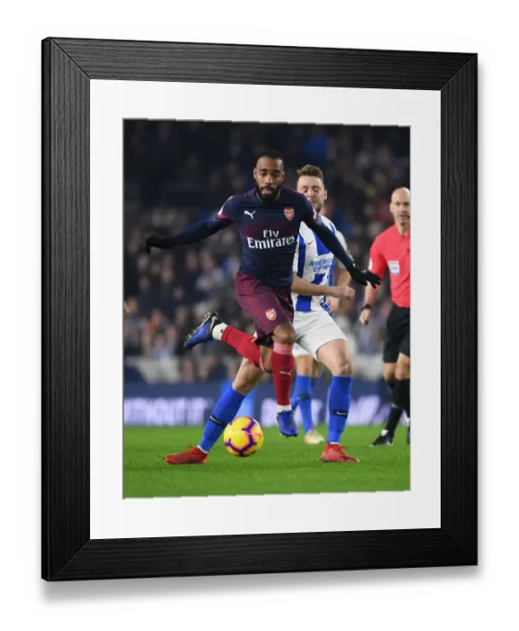 Framed Print : Arsenal's Lacazette Outmaneuvers Brighton's Stephens in Premier League Clash