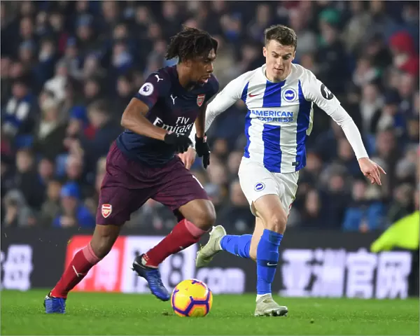 Arsenal's Alex Iwobi Outmaneuvers Brighton's Solly March in Premier League Clash