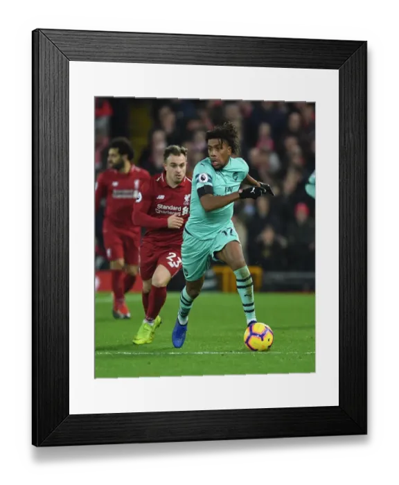 Framed Print : Arsenal's Iwobi Outsmarts Shaqiri: Thrilling Moment from the Intense Premier League Clash at Anfield (2018-19) Framed Print : Arsenal's Iwobi Outsmarts Shaqiri: Thrilling Moment from the Intense Premier League Clash at Anfield (2018-19)