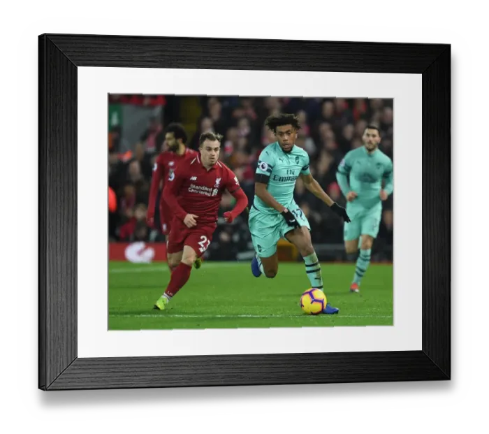 Framed Print : Iwobi Outsmarts Shaqiri: Intense Premier League Clash at Anfield