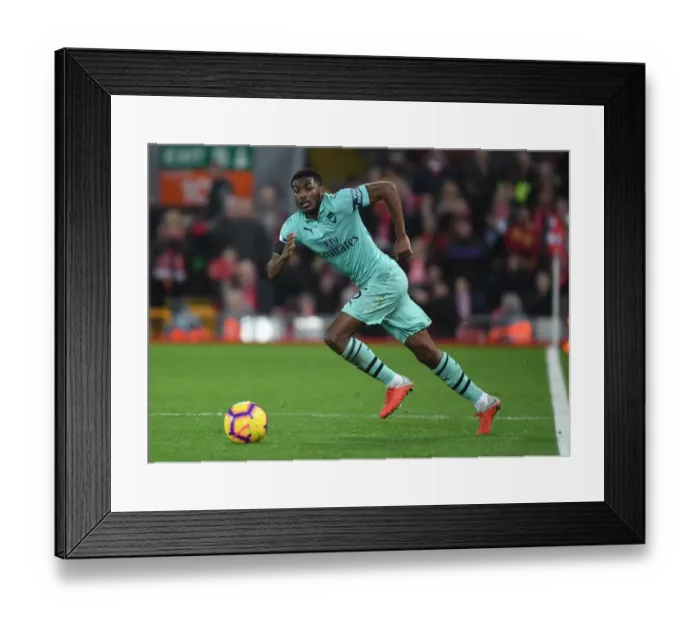 Framed Print : Arsenal's Ainsley Maitland-Niles Faces Off Against Liverpool at Anfield Framed Print : Arsenal's Ainsley Maitland-Niles Faces Off Against Liverpool at Anfield
