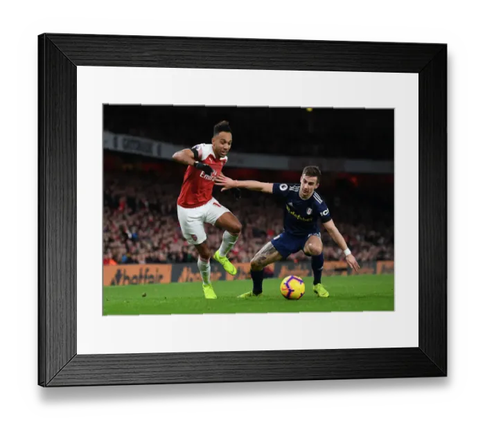 Framed Print : Arsenal's Aubameyang Clashes with Fulham's Bryan in Premier League Showdown