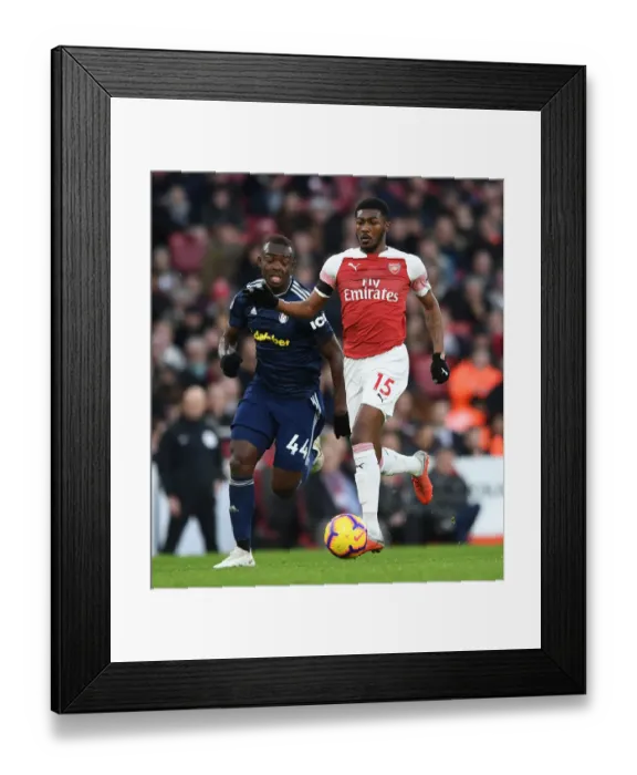 Framed Print : Arsenal's Ainsley Maitland-Niles Faces Off Against Fulham's Ibrahima Cisse Framed Print : Arsenal's Ainsley Maitland-Niles Faces Off Against Fulham's Ibrahima Cisse