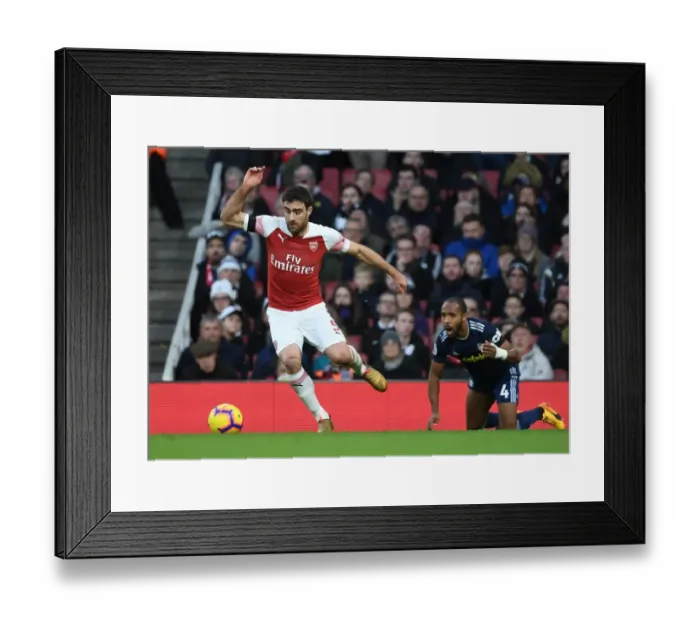 Framed Print : Arsenal's Sokratis Overpowers Fulham's Odoi in Premier League Clash at Emirates Stadium Framed Print : Arsenal's Sokratis Overpowers Fulham's Odoi in Premier League Clash at Emirates Stadium