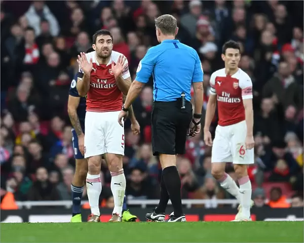 Arsenal's Sokratis Clashes with Referee during Arsenal v Fulham Premier League Match