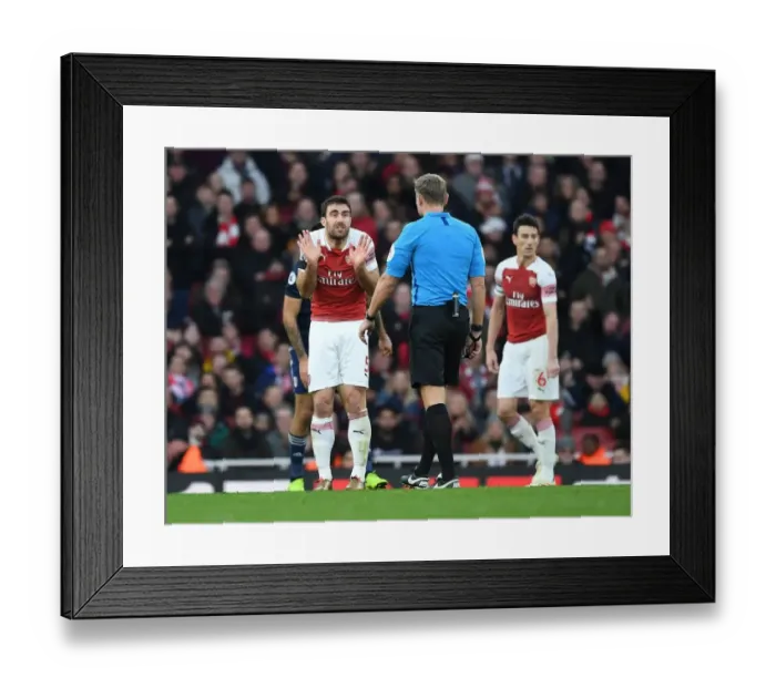 Framed Print : Arsenal's Sokratis Clashes with Referee during Arsenal v Fulham Premier League Match Framed Print : Arsenal's Sokratis Clashes with Referee during Arsenal v Fulham Premier League Match