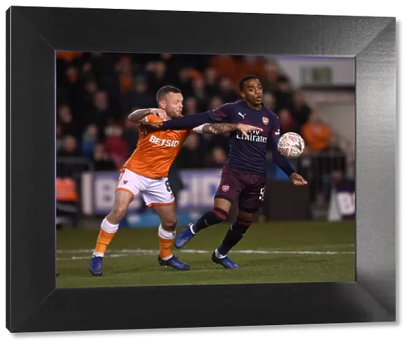 Joe Willock vs. Jay Spearing: Intense Face-Off in Arsenal's FA Cup Battle at Blackpool