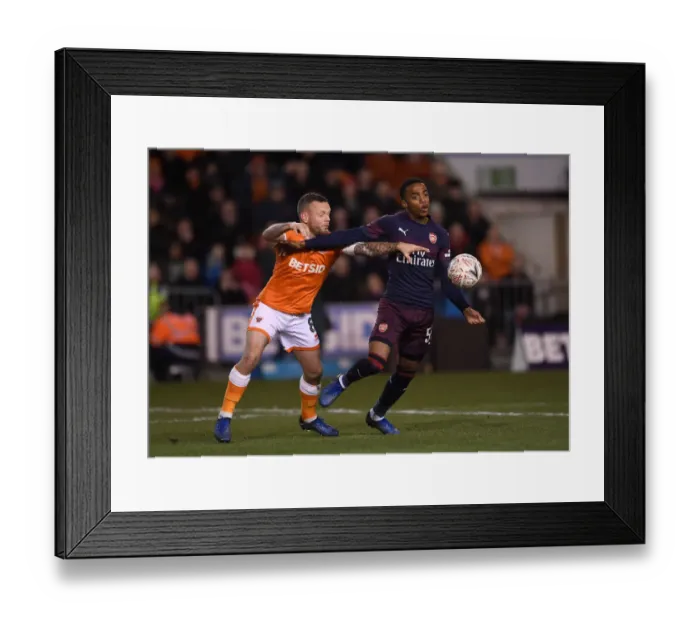 Framed Print : Joe Willock vs. Jay Spearing: Intense Face-Off in Arsenal's FA Cup Battle at Blackpool