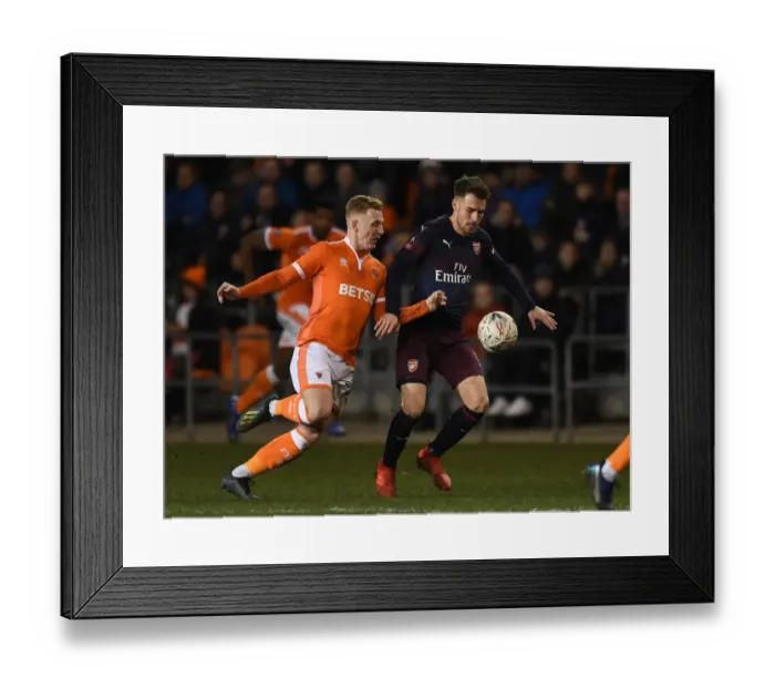 Framed Print : Ramsey vs. Guy: Arsenal's Midfield Battle in FA Cup Clash with Blackpool