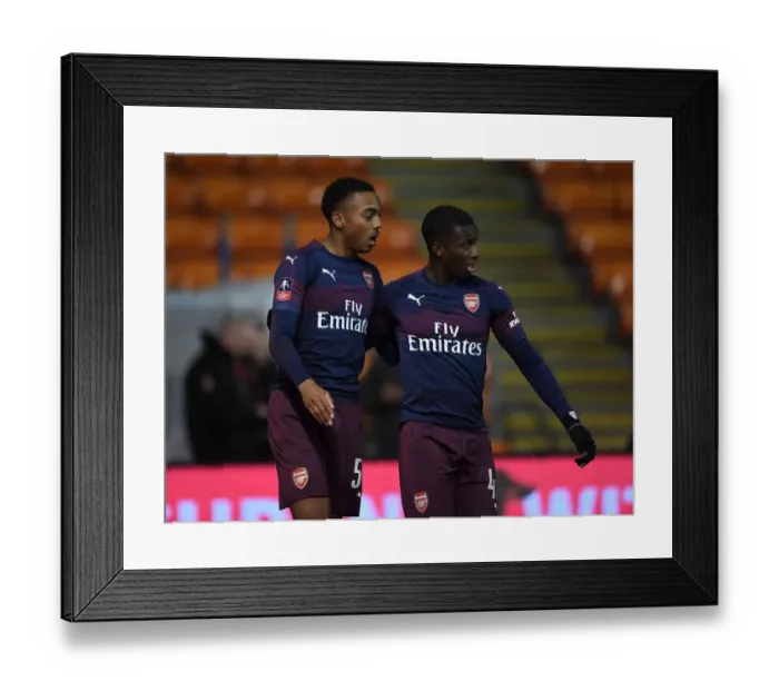 Framed Print : Arsenal's Joe Willock and Eddie Nketiah Celebrate Goal against Blackpool in FA Cup Third Round