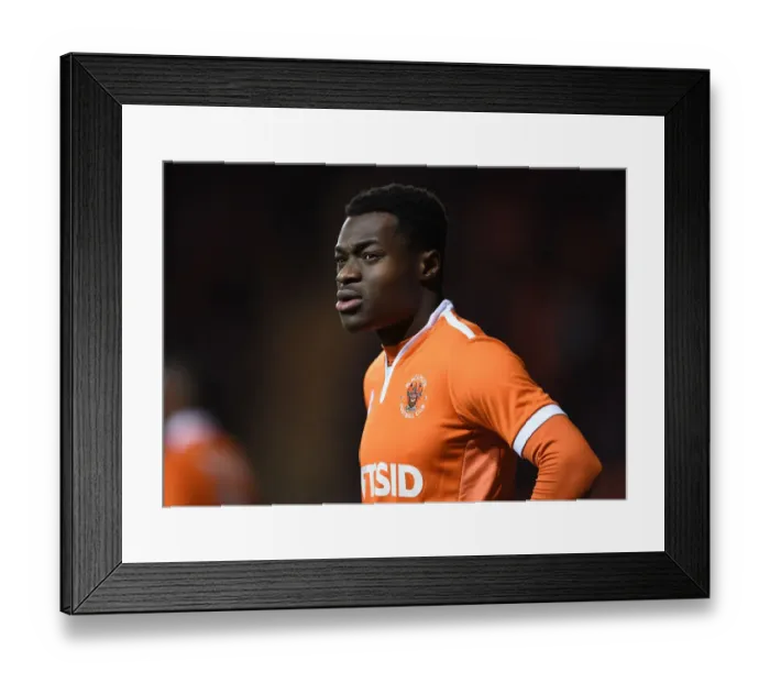 Framed Print : FA Cup Third Round: Marc Bola of Blackpool Faces Off Against Arsenal Framed Print : FA Cup Third Round: Marc Bola of Blackpool Faces Off Against Arsenal