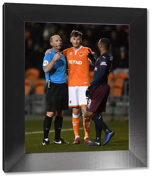 FA Cup Third Round: Referee Mike Dean Speaks with Alexandre Lacazette and Paudie O'Connor during Blackpool vs. Arsenal