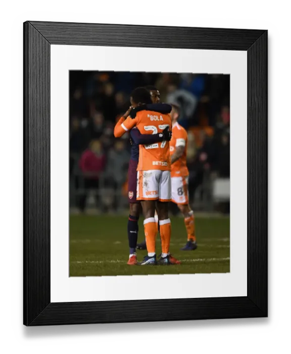 Framed Print : Arsenal's Maitland-Niles Embraces Blackpool's Bola After FA Cup Third Round Match