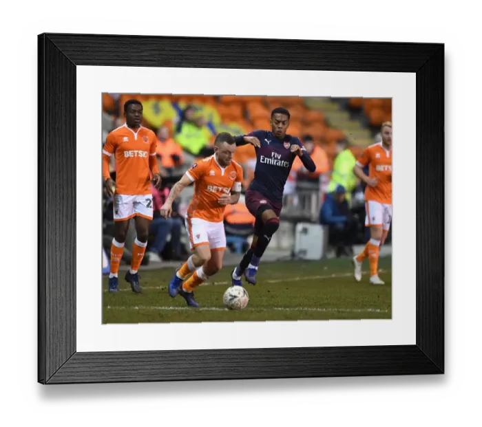 Framed Print : Arsenal's Joe Willock Clashes with Blackpool's Jay Spearing in FA Cup Third Round Framed Print : Arsenal's Joe Willock Clashes with Blackpool's Jay Spearing in FA Cup Third Round