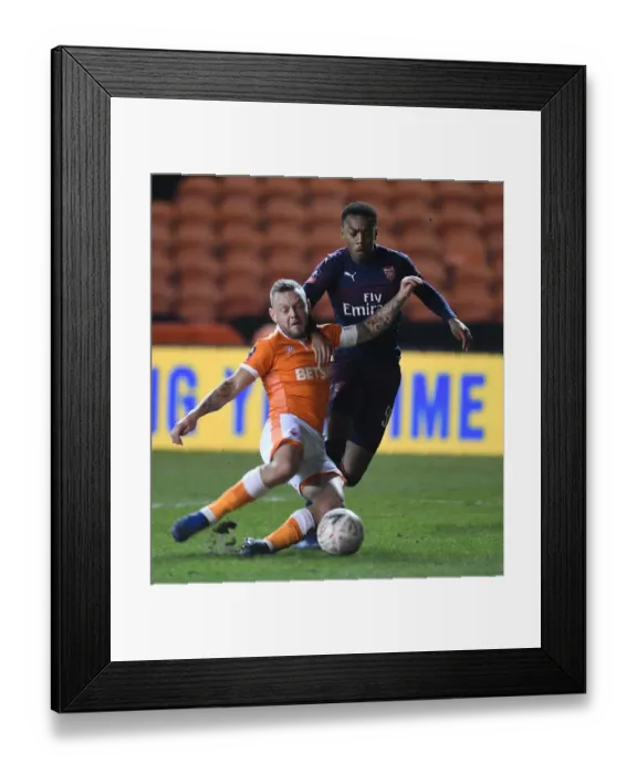 Framed Print : Blackpool vs Arsenal: FA Cup Third Round Clash - Joe Willock Faces Off Against Jay Spearing