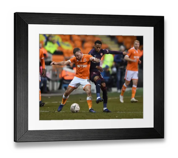 Framed Print : Joe Willock vs. Jay Spearing: Intense Face-Off in FA Cup Clash between Arsenal and Blackpool