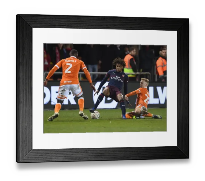 Framed Print : Arsenal's Alex Iwobi Faces Off Against Blackpool Defenders in FA Cup Clash