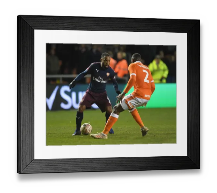 Framed Print : Arsenal's Lacazette Faces Off Against Blackpool's Daniels in FA Cup Clash