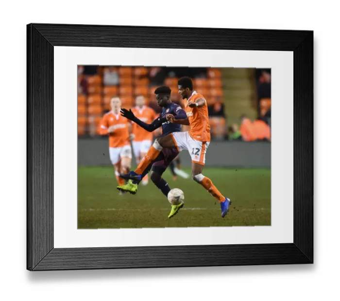 Framed Print : Blackpool vs Arsenal: FA Cup Third Round Clash - Buyako Saka Faces Off Against Michael Nottingham Framed Print : Blackpool vs Arsenal: FA Cup Third Round Clash - Buyako Saka Faces Off Against Michael Nottingham