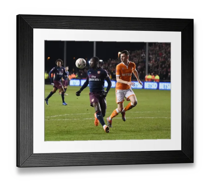 Framed Print : Arsenal's Eddie Nketiah Fends Off Blackpool's Jimmy Ryan in FA Cup Clash