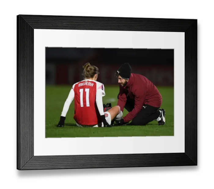 Framed Print : Arsenal Women: Vivianne Miedema Receives Treatment from Physio Sam Blanchard during FA WSL Continental Tyres Cup Match