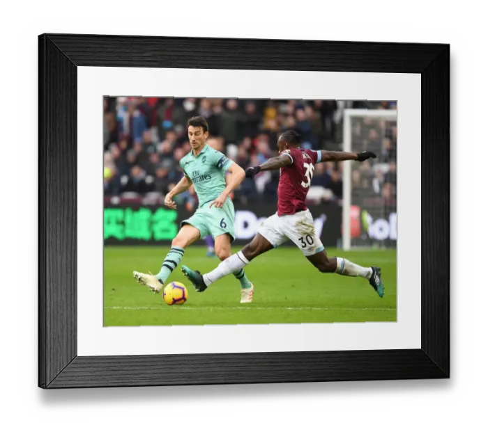 Framed Print : Clash at London Stadium: Laurent Koscielny vs Michail Antonio - West Ham United vs Arsenal FC, Premier League 2018-19