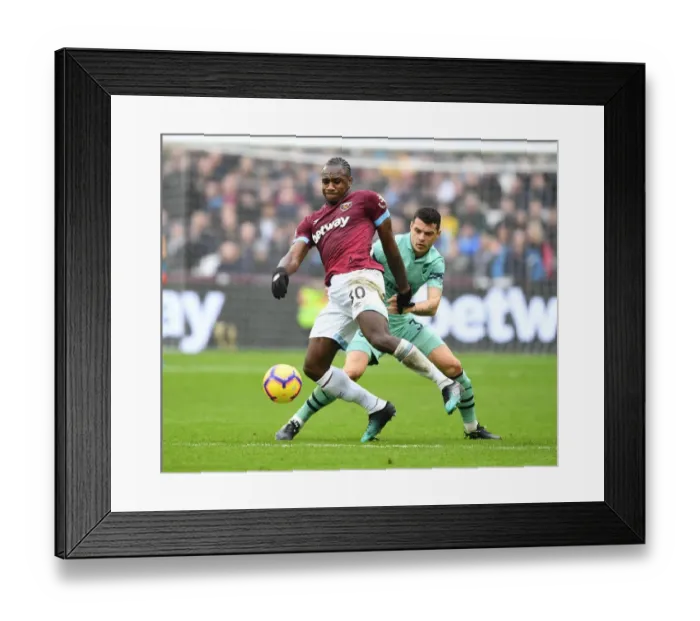Framed Print : Granit Xhaka vs Michail Antonio: Intense Battle in West Ham United vs Arsenal FC Premier League Clash