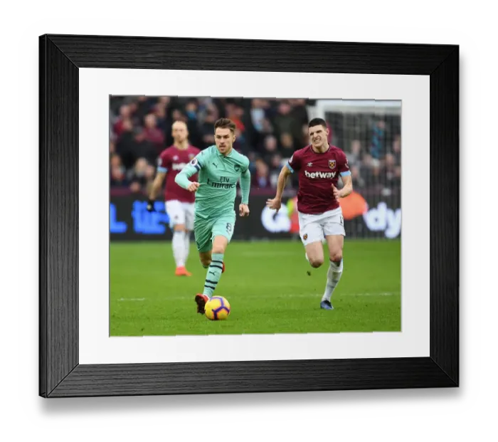 Framed Print : Ramsey Outwits Rice: Arsenal Star Outmaneuvers West Ham Midfielder in Premier League Clash Framed Print : Ramsey Outwits Rice: Arsenal Star Outmaneuvers West Ham Midfielder in Premier League Clash