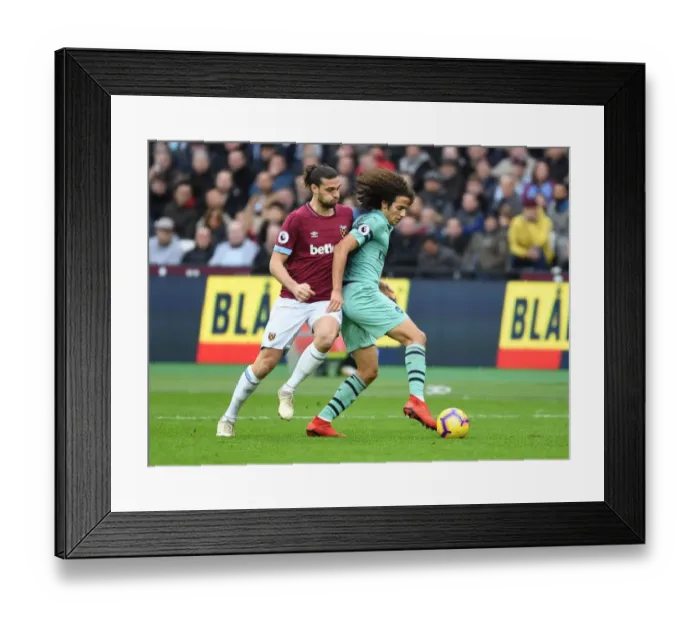 Framed Print : Guendouzi vs Carroll: Intense Clash Between West Ham and Arsenal in Premier League