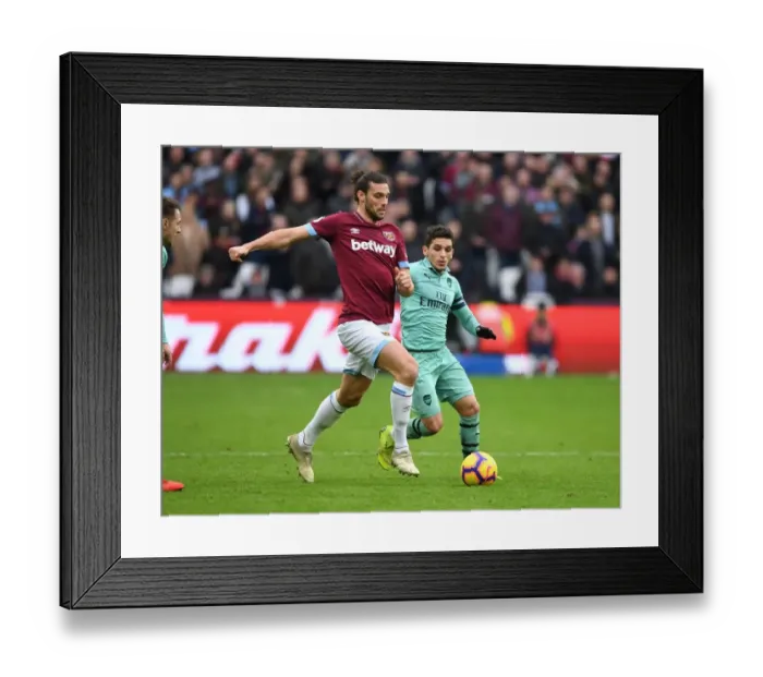 Framed Print : Arsenal's Torreira Faces Off Against West Ham's Carroll in Premier League Clash