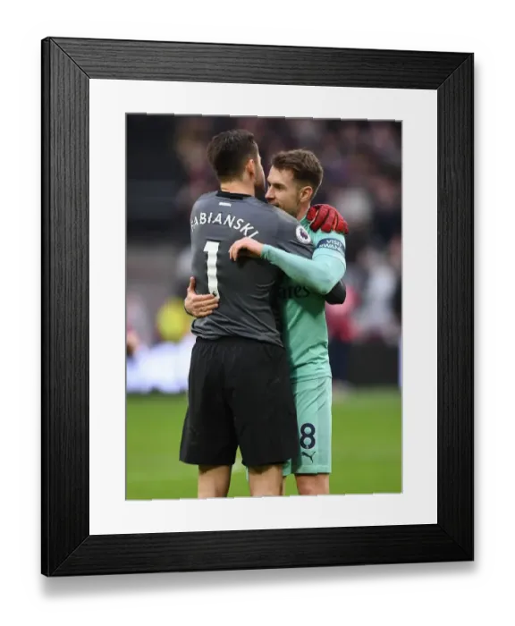 Framed Print : Ramsey and Fabianski Reunite: A Heartfelt Embrace at West Ham vs Arsenal, Premier League 2018-19