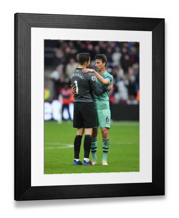 Framed Print : Former Teammates Reunited: Koscielny Embraces Fabianski After West Ham vs. Arsenal Clash Framed Print : Former Teammates Reunited: Koscielny Embraces Fabianski After West Ham vs. Arsenal Clash