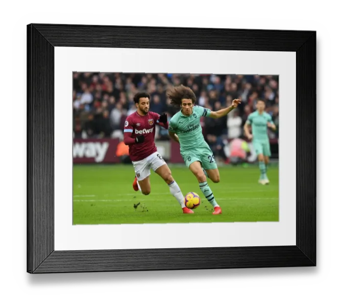 Framed Print : Guendouzi vs. Anderson: A Premier League Battle at London Stadium Framed Print : Guendouzi vs. Anderson: A Premier League Battle at London Stadium