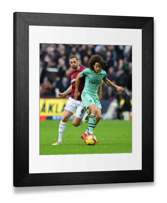 Framed Print : Guendouzi vs Carroll: A Premier League Battle - Arsenal vs West Ham Framed Print : Guendouzi vs Carroll: A Premier League Battle - Arsenal vs West Ham