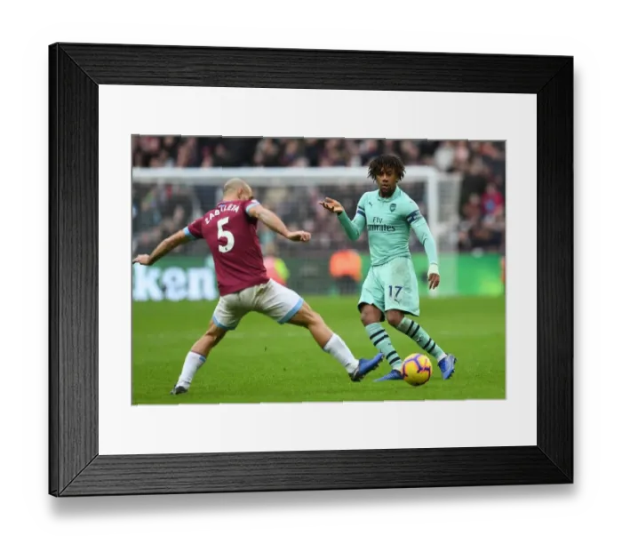 Framed Print : Alex Iwobi Outsmarts Pablo Zabaleta: Arsenal's Skillful Midfielder Beats West Ham Defender Framed Print : Alex Iwobi Outsmarts Pablo Zabaleta: Arsenal's Skillful Midfielder Beats West Ham Defender