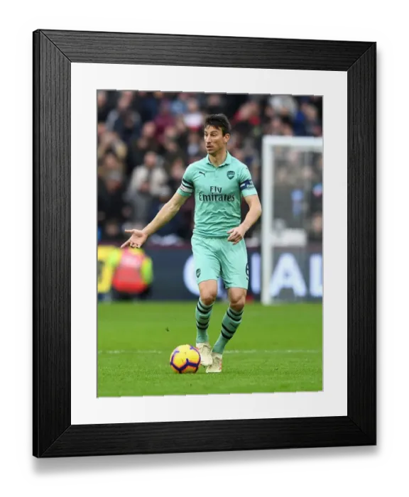 Framed Print : Laurent Koscielny Focused Amidst the Action: West Ham United vs Arsenal FC, Premier League 2018-19 Framed Print : Laurent Koscielny Focused Amidst the Action: West Ham United vs Arsenal FC, Premier League 2018-19