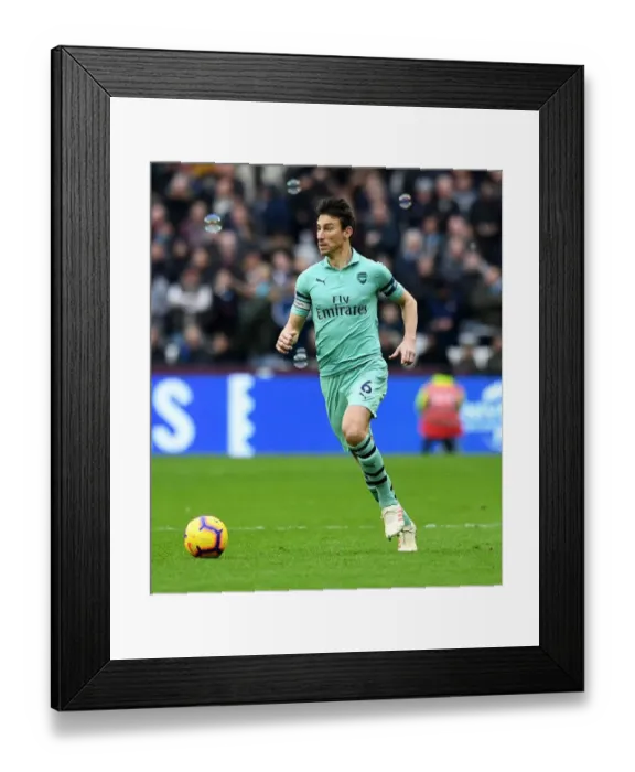 Framed Print : Laurent Koscielny: Unyielding Focus in the Heart of the Premier League Battle (West Ham United vs Arsenal FC, 2019)