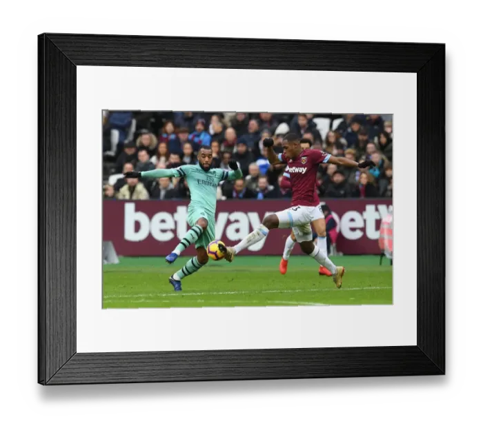Framed Print : Clash at the London Stadium: Lacazette vs. Diop - Arsenal vs. West Ham United, Premier League Framed Print : Clash at the London Stadium: Lacazette vs. Diop - Arsenal vs. West Ham United, Premier League
