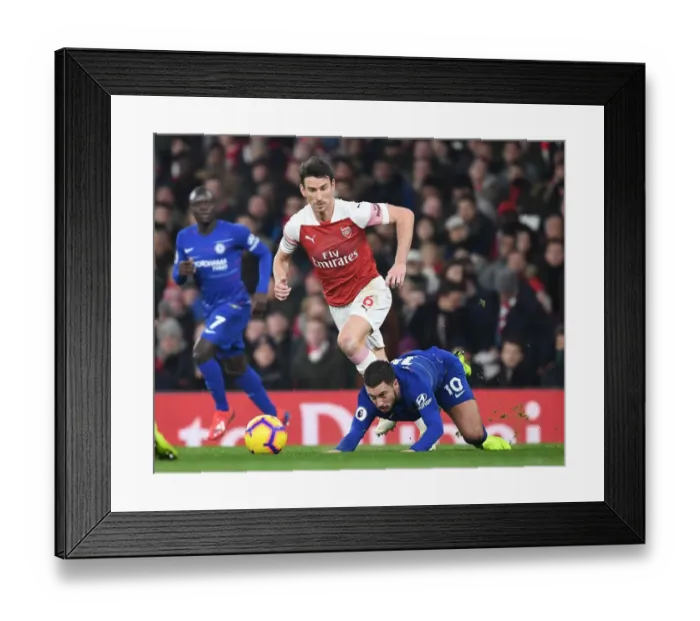 Framed Print : Arsenal vs. Chelsea: Koscielny vs. Pedro - Premier League Showdown at Emirates Stadium Framed Print : Arsenal vs. Chelsea: Koscielny vs. Pedro - Premier League Showdown at Emirates Stadium